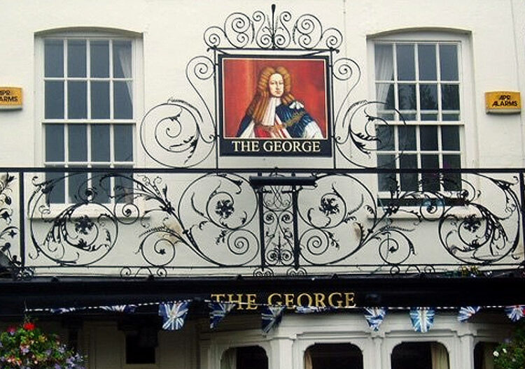 ornate wrought iron balcony on a pub